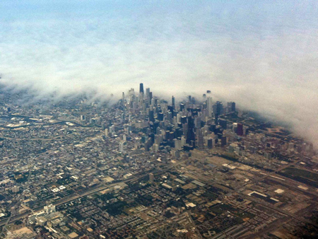 Fog shrouding Lake Michigan spills over the Chicago Lakefront